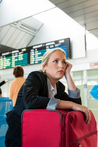 business woman waiting for her departure at the airport. symboli